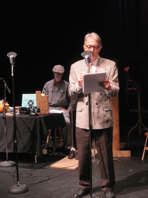 Fred Crafts, at the mic, and his sound man Jonathan Ward, who provided sound effects for the recent production of “Sam Spade and the Buddha’s Tooth Caper,” such as dramatically dropping a sand bag when a man falls out of a ninth story window.